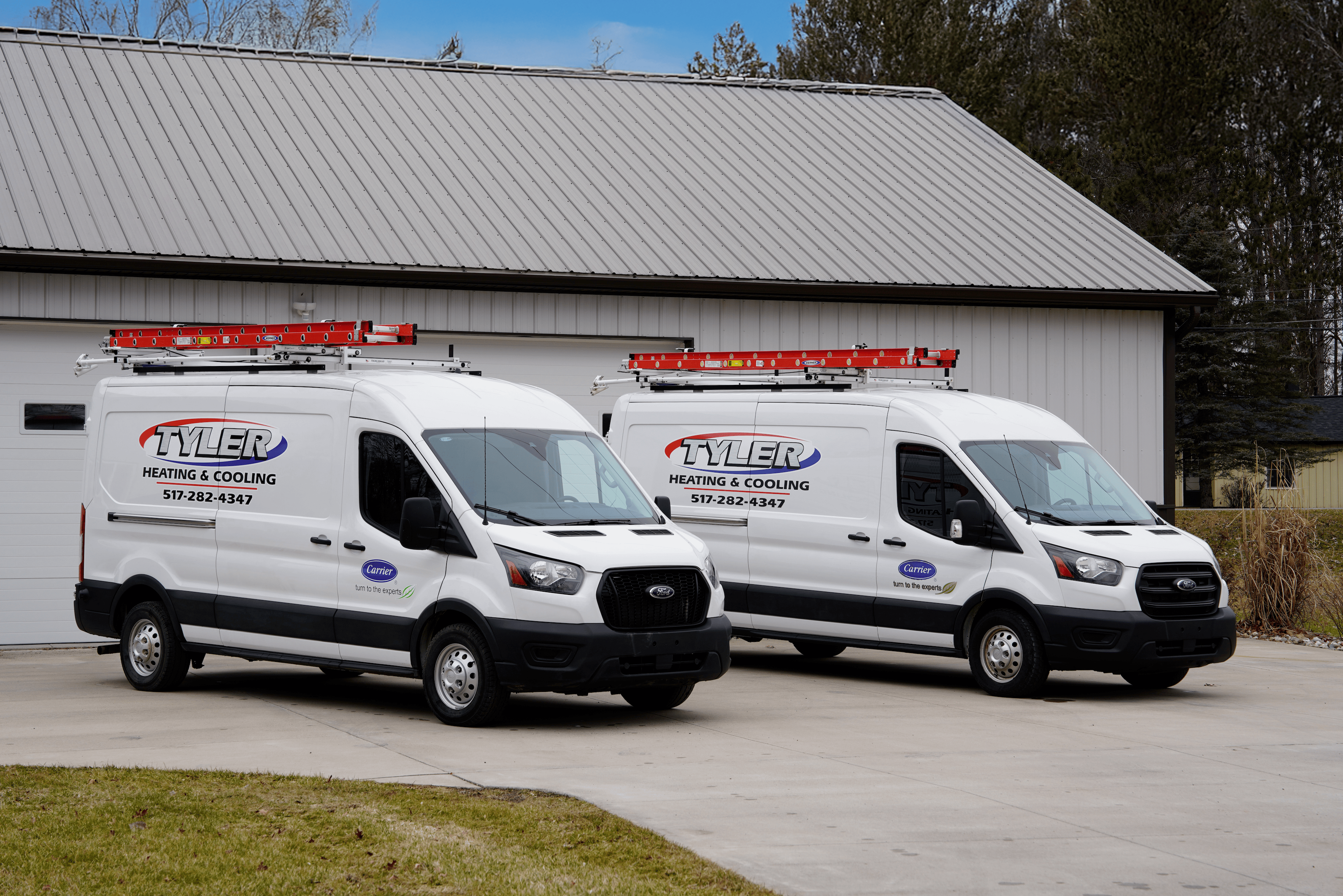 Service vans parked in front of building