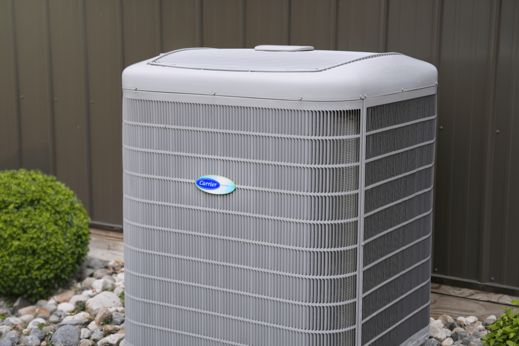 A Carrier high-efficiency heat pump unit outside of a business